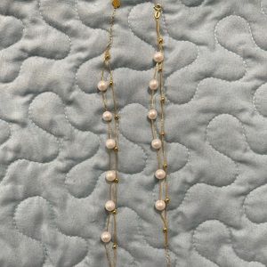 Two strand fresh water pearl bracelet in 18k gold setting